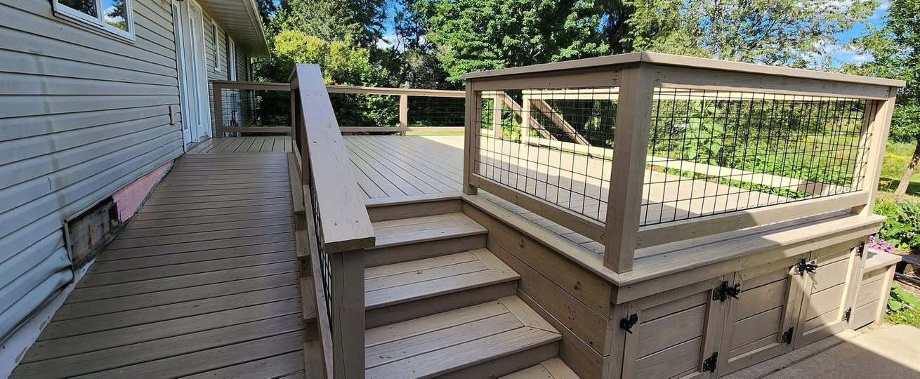 Multi-level natural wood deck with wide steps and hog-wire railings built by T & A Contracting