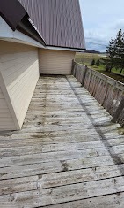 Weathered aging wood deck on an elevated home before replacement by T & A Contracting