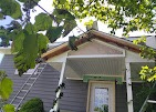 White fascia and seamless gutter along a bungalow roofline installed by T & A Contracting