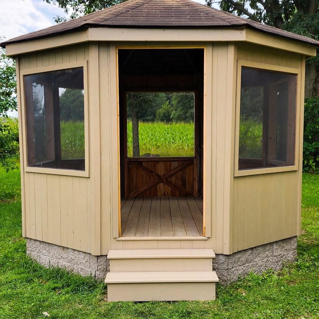 Restored screened gazebo with fresh paint and new steps by T & A Contracting