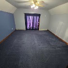 Bedroom repainted with two-tone walls and white trim by T & A Contracting