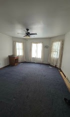 Living room repainted with neutral walls and white trim by T & A Contracting