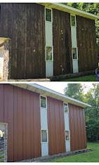 Cabin resided from weathered wood to warm board-and-batten with white-trim windows by T & A Contracting