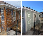 Worn exterior replaced with fresh siding and decorative white trim accents by T & A Contracting